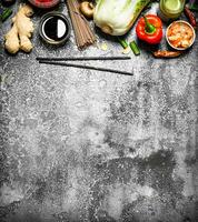 Asian food. A variety of ingredients for cooking Asian food on rustic background. photo