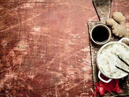 Asian food. Rice with soy sauce and pickled ginger . photo