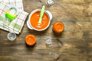 Baby food. Baby puree carrot with a nipple. photo