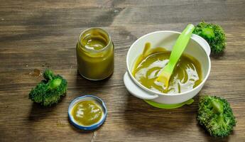 Baby food. Baby puree from broccoli. photo