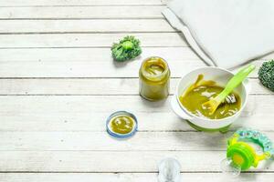 Baby food. Baby puree from broccoli. photo