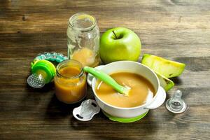 Baby food. Baby puree from green apples. photo