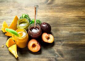 Baby food. Variety of baby purees from fruits and vegetables. photo