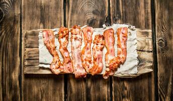 Fried bacon on the fabric. photo