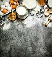 Baking background. A variety of ingredients for baking on rustic background. photo