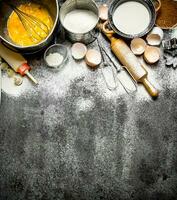 Baking background. A variety of ingredients for baking on rustic background. photo