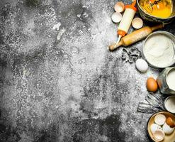 Baking background. A variety of ingredients for baking on rustic background. photo