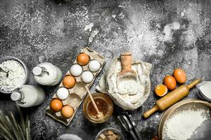 Baking background. Ingredients and tools for dough preparation. photo