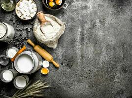 Baking background. Milk, flour and other ingredients for the dough. photo