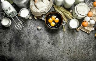 Baking background. Milk, flour and other ingredients for the dough. photo