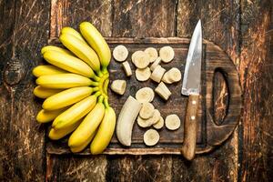 Bananas on a cutting Board. photo