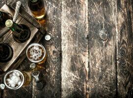 Beer in a box with glasses. photo