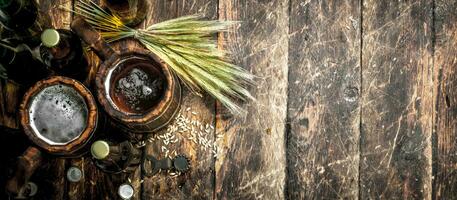 Fresh beer in a wooden mug. photo