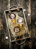 Glasses with fresh beer on an old tray. photo