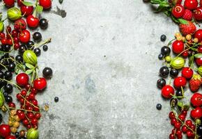 Fresh berries on a stone background. photo