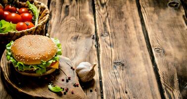 Fresh hamburger with vegetables, meat and spices. photo