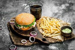 Street food. Burger with cola and fries. photo