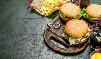 Street food. Burgers with fries and cola. photo