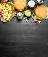 Fast food. Burgers with fries and cola. photo