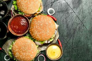 Fast food. Fresh burgers with cola. photo