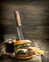 Big burger with cola and fries. photo