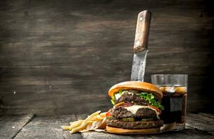 Big burger with cola and fries. photo