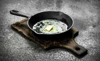 Butter in an old pan. photo