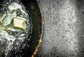 Butter in an old pan. photo