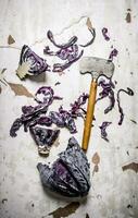 fresh cabbage with a hatchet. photo