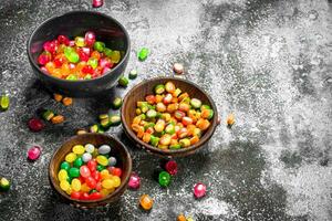 Fruit candies. On rustic background. photo