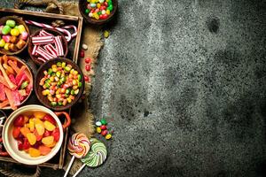 Various sweets, candies, jelly, marshmallows and candied fruits. photo