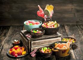 Different sweet candy, jelly, marshmallows and candied fruits. photo