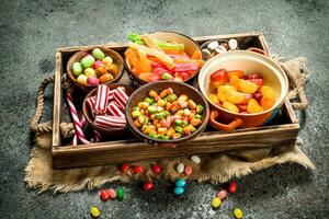 Various sweets, candies, jelly, marshmallows and candied fruits. photo