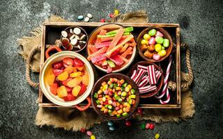 Various sweets, candies, jelly, marshmallows and candied fruits. photo