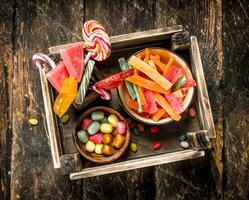 Different sweet candy, jelly, marshmallows and candied fruits. photo