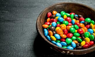 Different baby sweets in bowls. photo