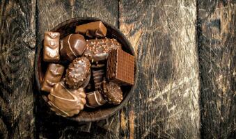 Chocolate candies in a bowl. photo