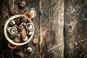 Chocolate candies in a bowl. photo