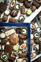 Chocolate candies in boxes photo