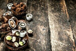 Chocolate candies in a bowls. photo