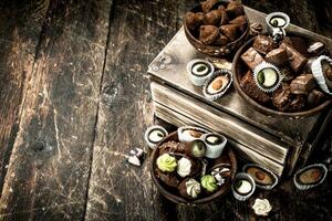 Chocolate candies in a bowls. photo