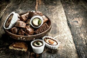 Chocolate candies in a bowl. photo