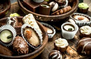 Chocolate candies in a bowls. photo