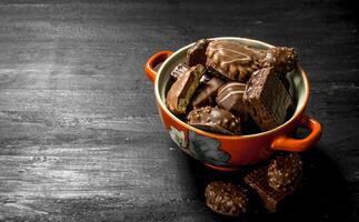 Chocolate candies in a bowl. . photo