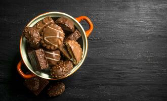 Chocolate candies in a bowl. . photo