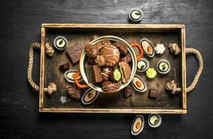 Chocolate candies in a bowl. . photo