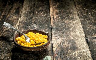 Canned corn in a bowl. photo