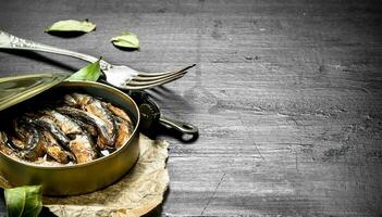 Canned sprats in a tin can. photo