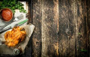 Fried chicken with herbs and sauce. photo