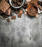Different kinds of chocolate in bowls. photo
